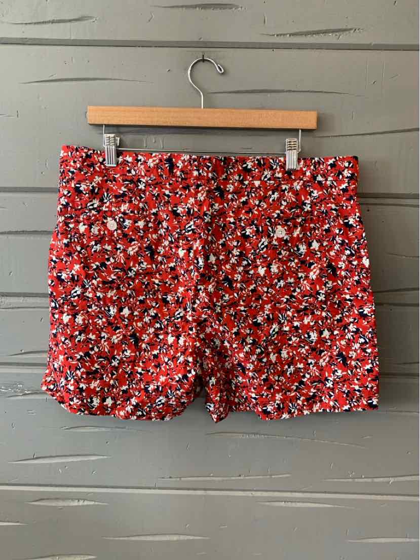 Red floral patterned women's shorts with a fitted waistband and side pockets, size 14.