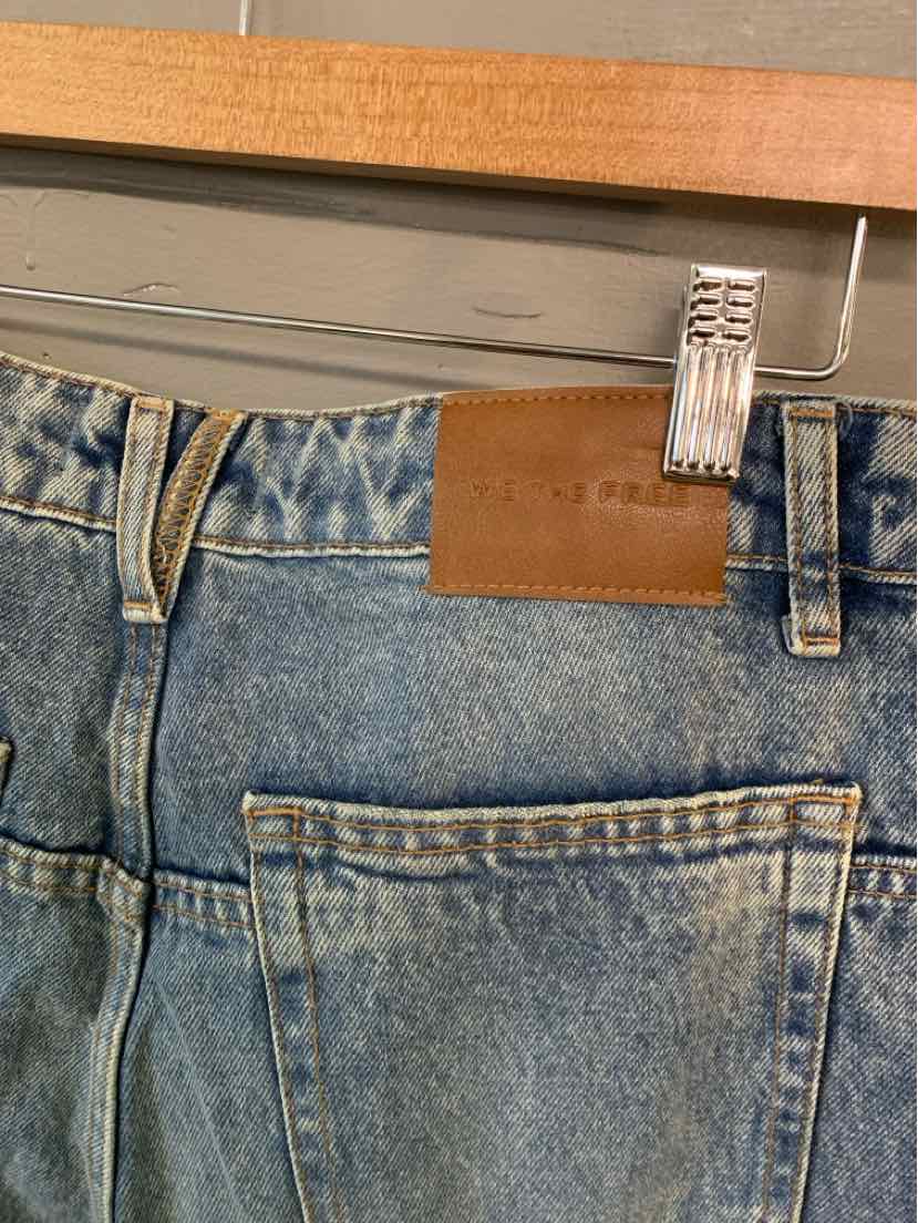 Light blue denim jeans with a classic five-pocket design and a brown leather patch on the waistband.
