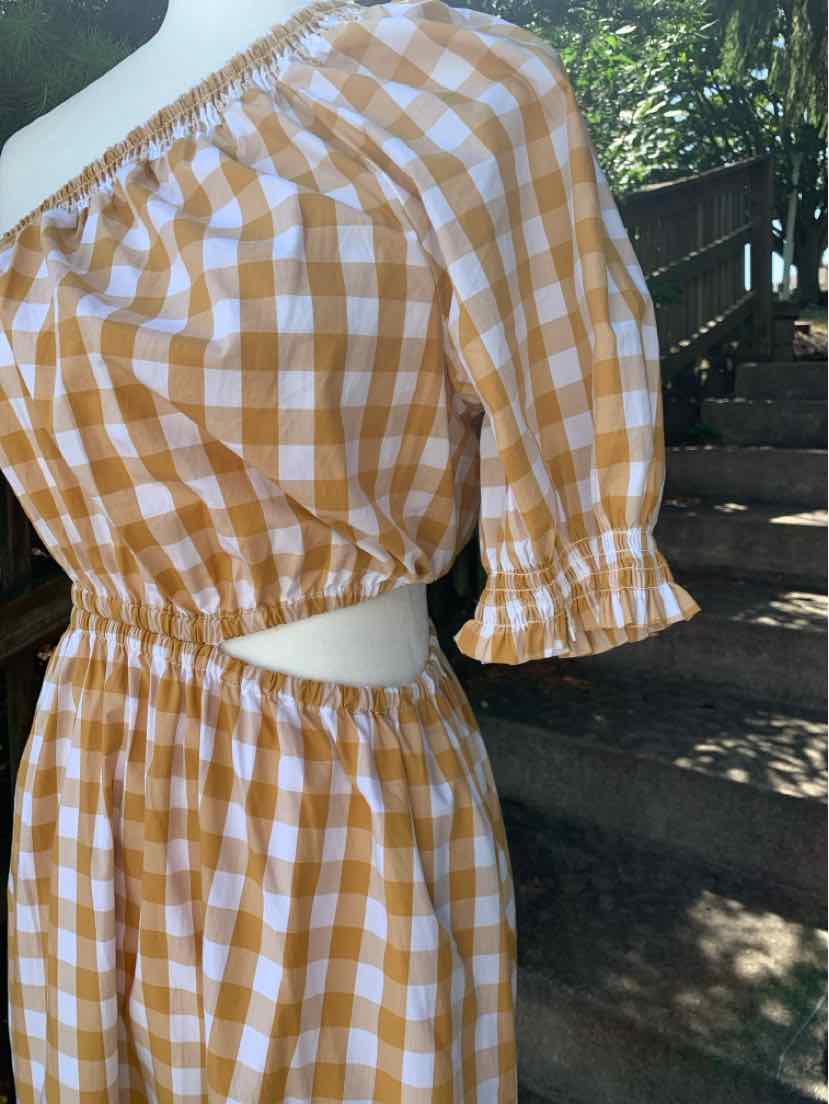 Tan and white gingham off-shoulder dress with elastic waist and ruffled sleeves in size XS.