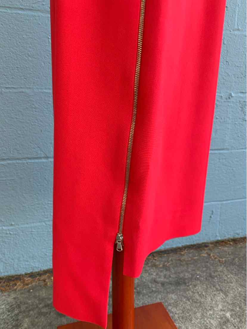 Red wide-leg pants with front zip detail in size 10 on mannequin against gray wall background.