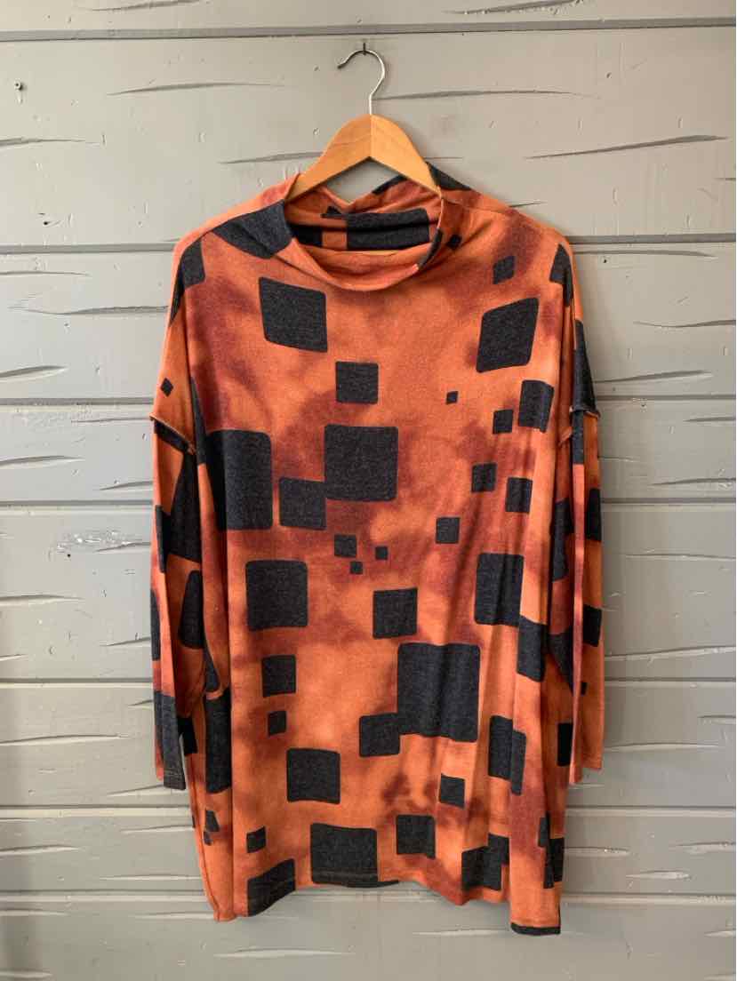 Orange abstract-print tunic with black square accents, long sleeves, and a draped cowl neckline.