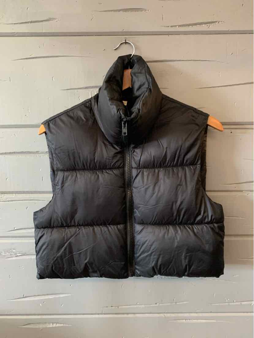 Black quilted puffer vest with high collar and sleeveless design, size XS.