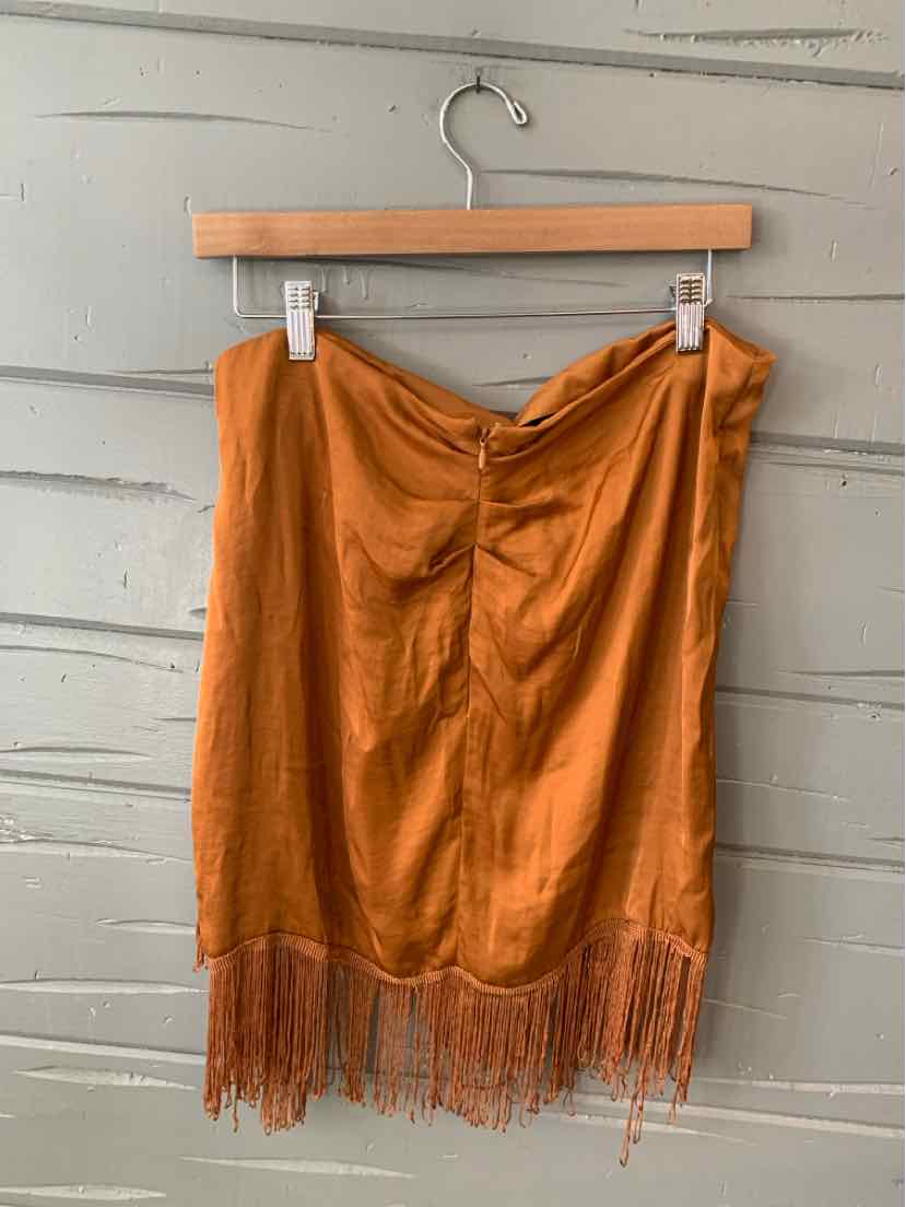 Bronze satin skirt with gathered front and fringe hem, size large, hanging on wooden hanger.