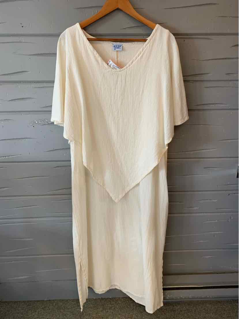 Creamy white loose-fit gauze dress with wide V-neck and asymmetrical layered hem.