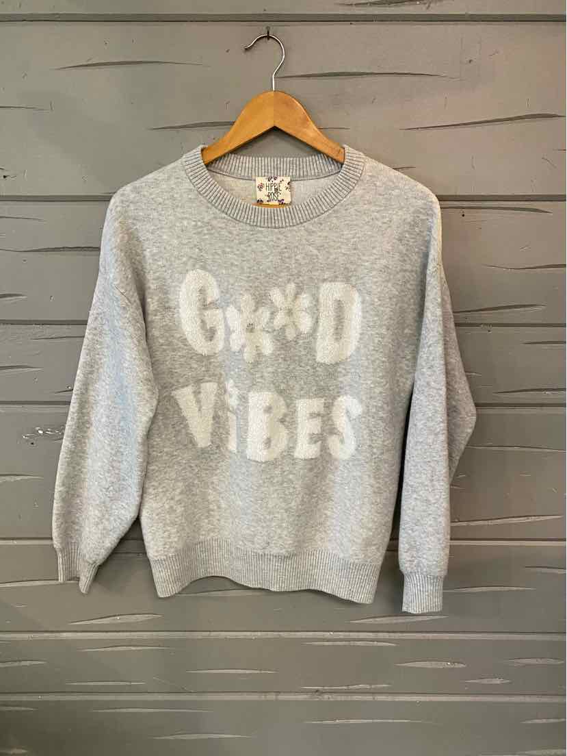 Light gray crewneck sweatshirt with textured "Good Vibes" text and floral graphic on front, long sleeves, relaxed fit.