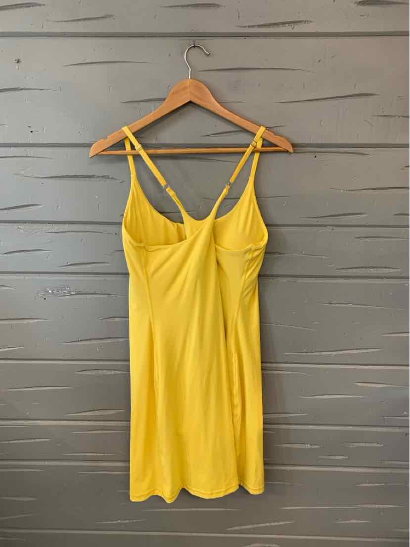 Yellow sleeveless dress with fitted bodice and adjustable thin straps, size XL.