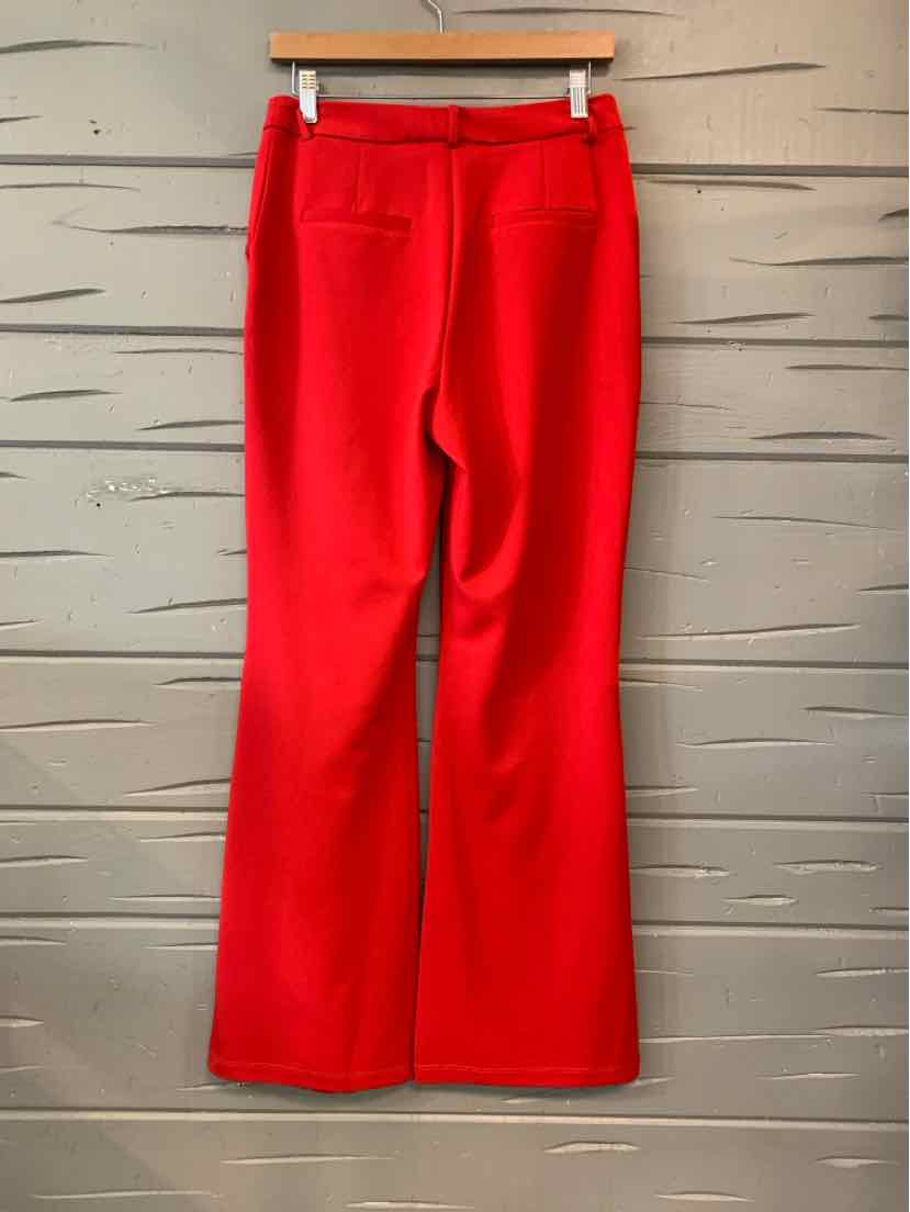 Bright red women's pants with a smooth, solid finish, straight legs, and a front waistband closure.