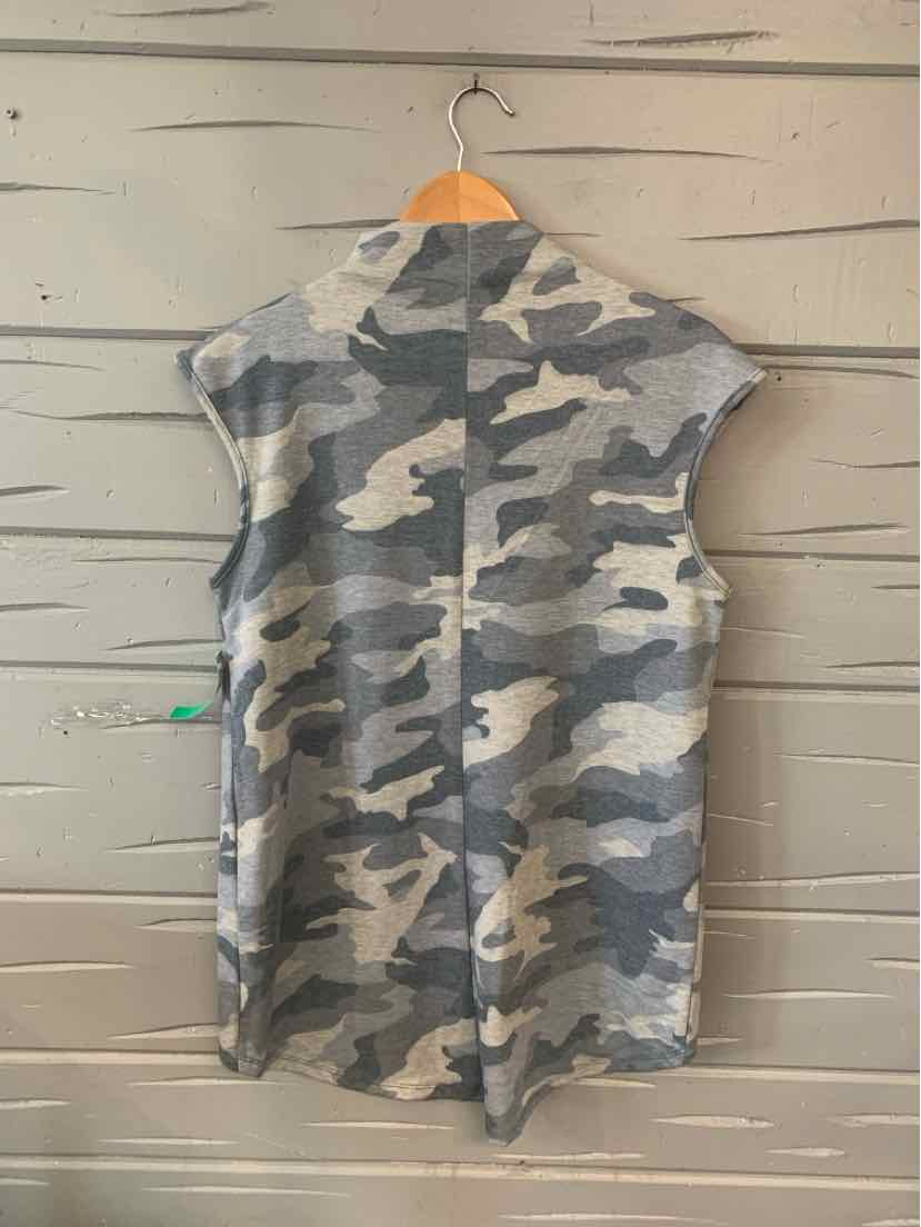 Gray camouflage sleeveless hoodie dress with relaxed fit hanging on wooden hanger.