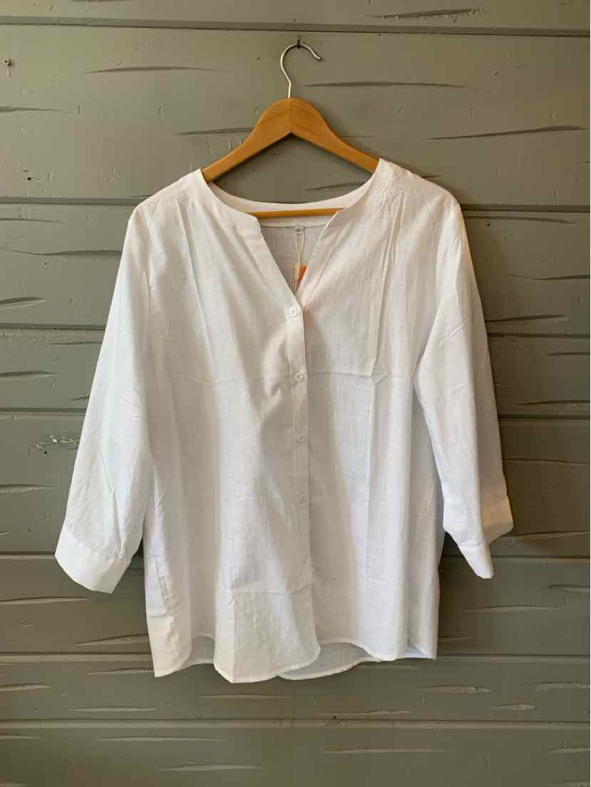 White long-sleeve blouse with V-neck and loose fit on wooden hanger.