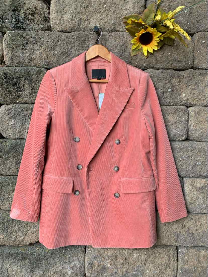 Pink corduroy double-breasted blazer with notch lapels and flap pockets, size 8.