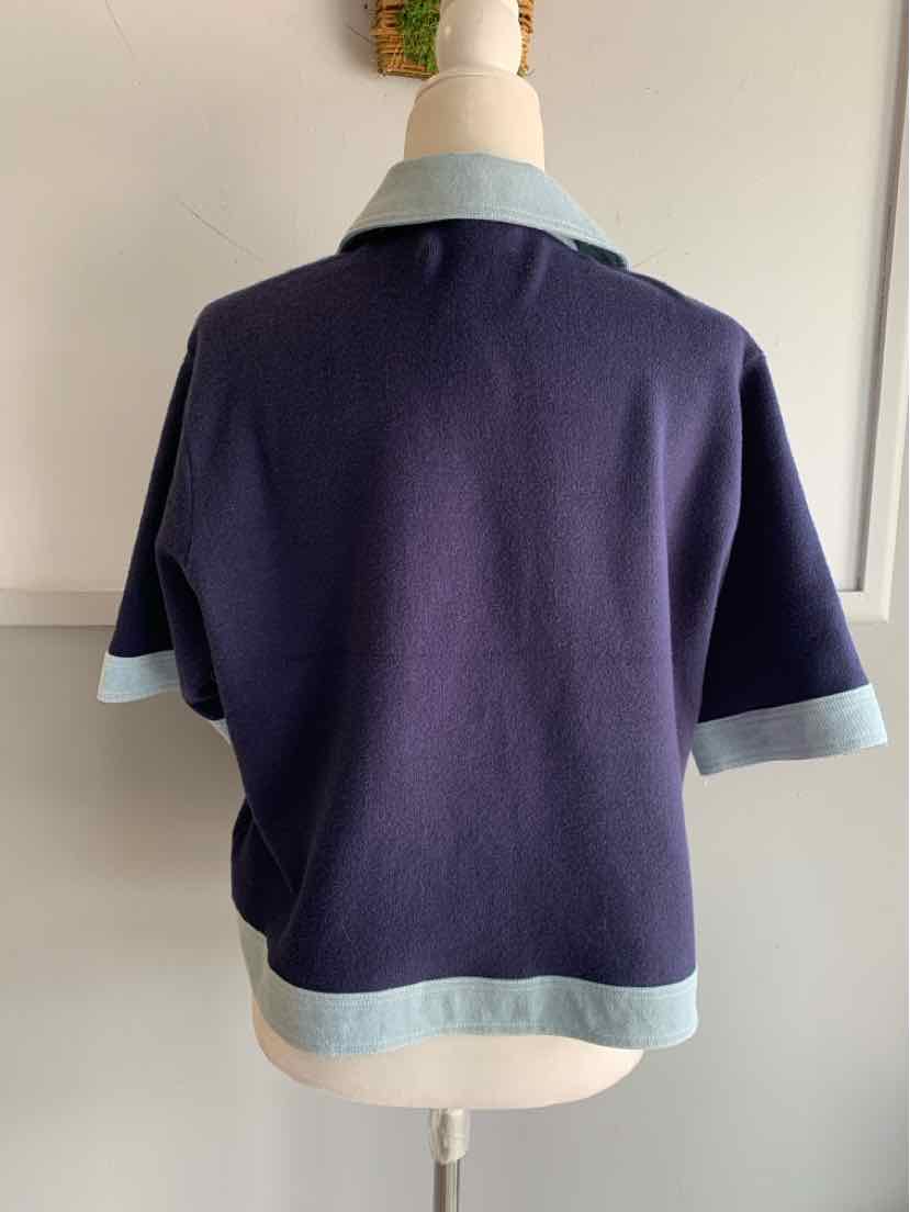 Navy short-sleeve sweater with light blue collar, cuffs, and hem in size large.
