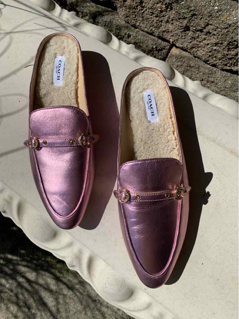 Metallic pink leather slip-on loafers with gold-tone horsebit detail and tan sole, size 9.