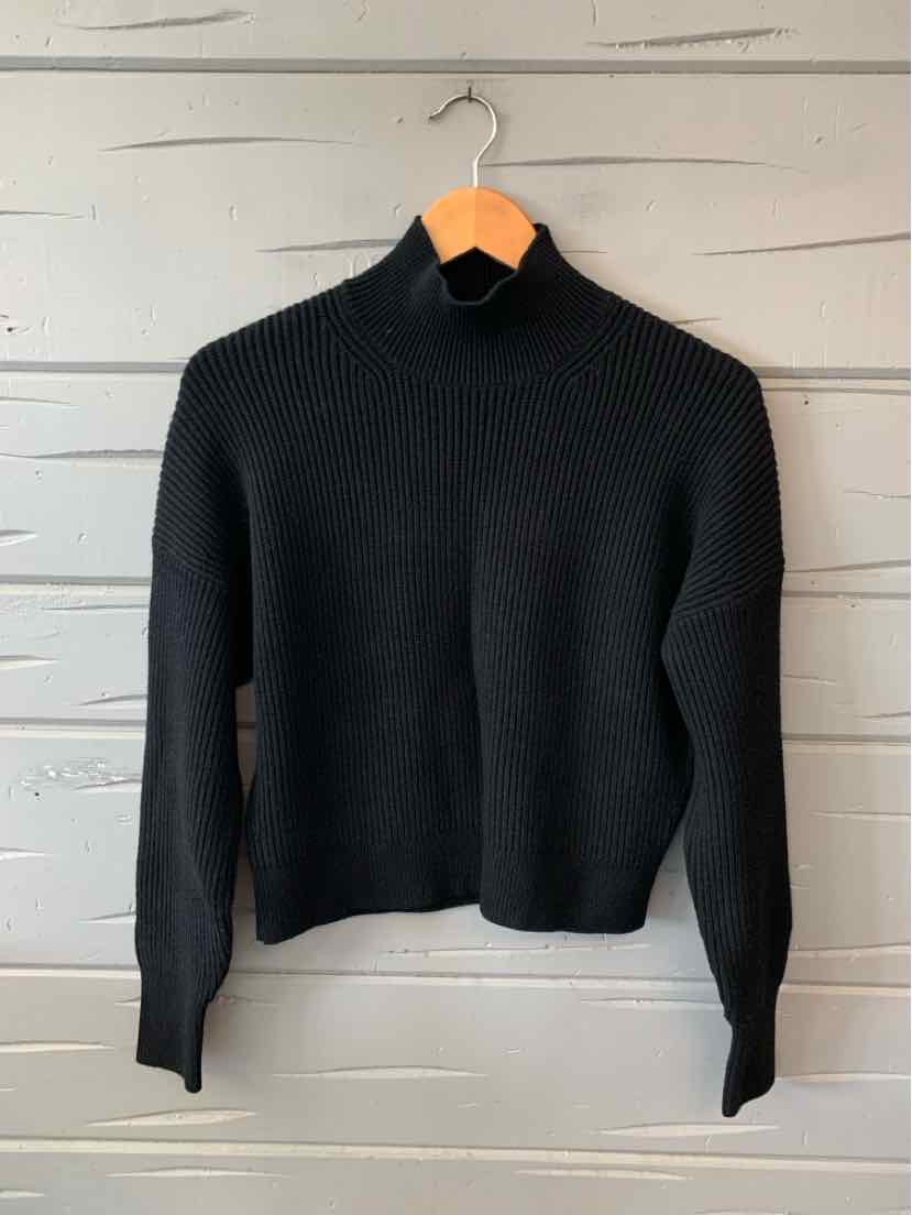 Black long-sleeve ribbed knit sweater with mock neck and fitted cuffs, medium size.