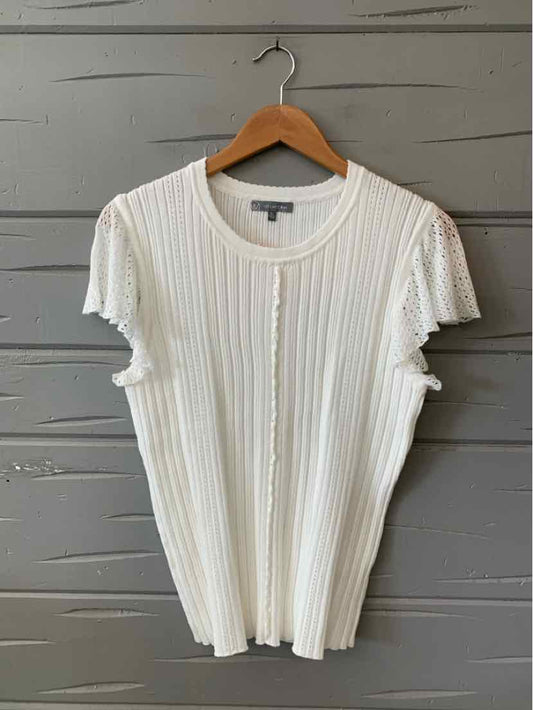 White ribbed knit short-sleeve top with crew neckline in women's XL size.