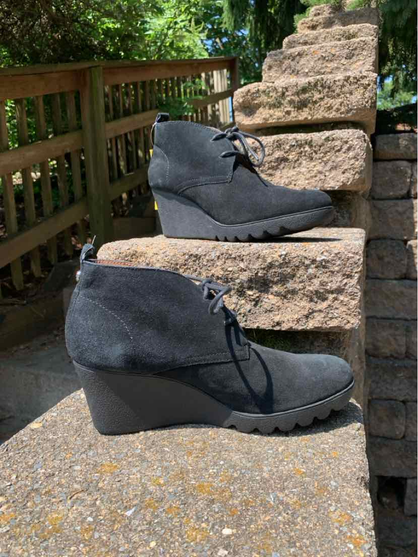 Black suede wedge ankle boots with lace-up front and ridged rubber sole, size 8.