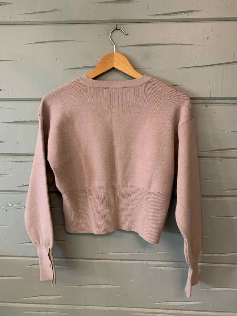 Mauve long-sleeve knit sweater with a crew neckline, ribbed cuffs, and a cropped hem.