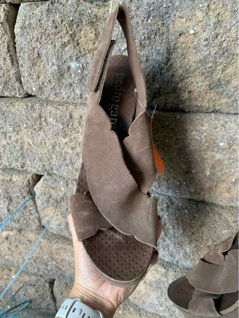 Brown suede wedge sandal with crisscross straps and open toe, size 40.
