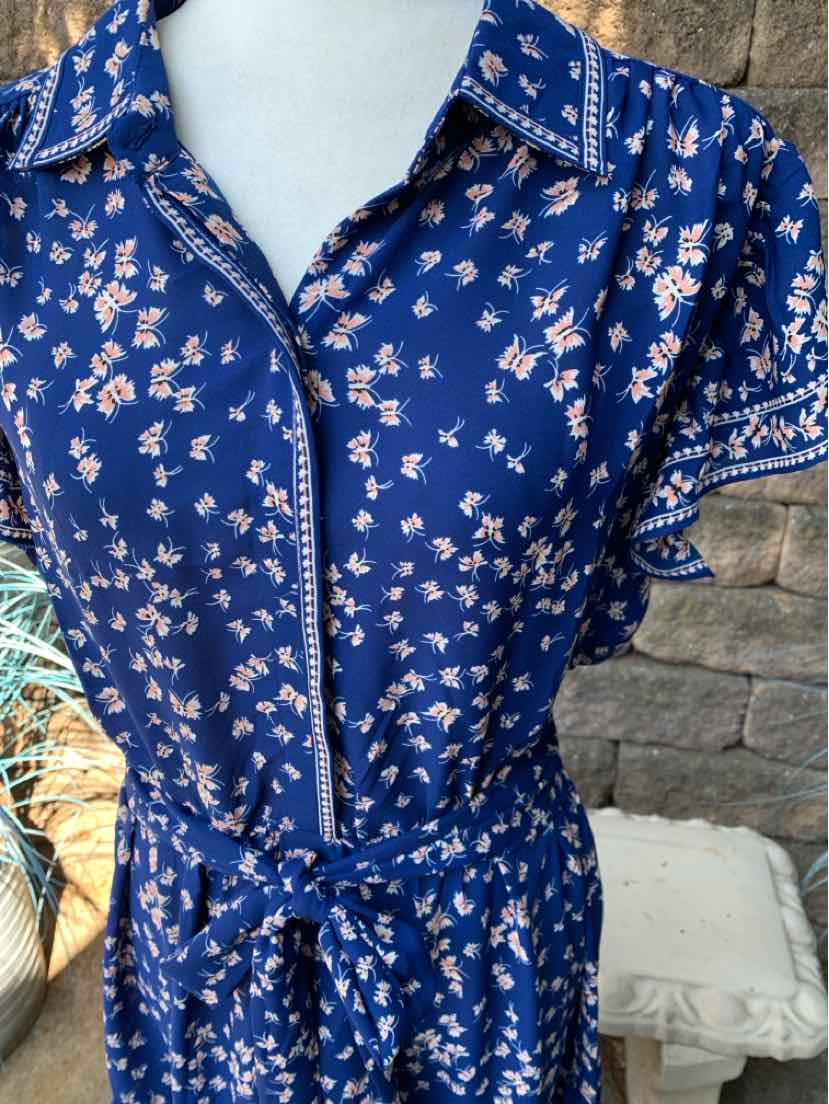 Navy blue floral dress with short sleeves, collar, front buttons, and fabric belt at waist.