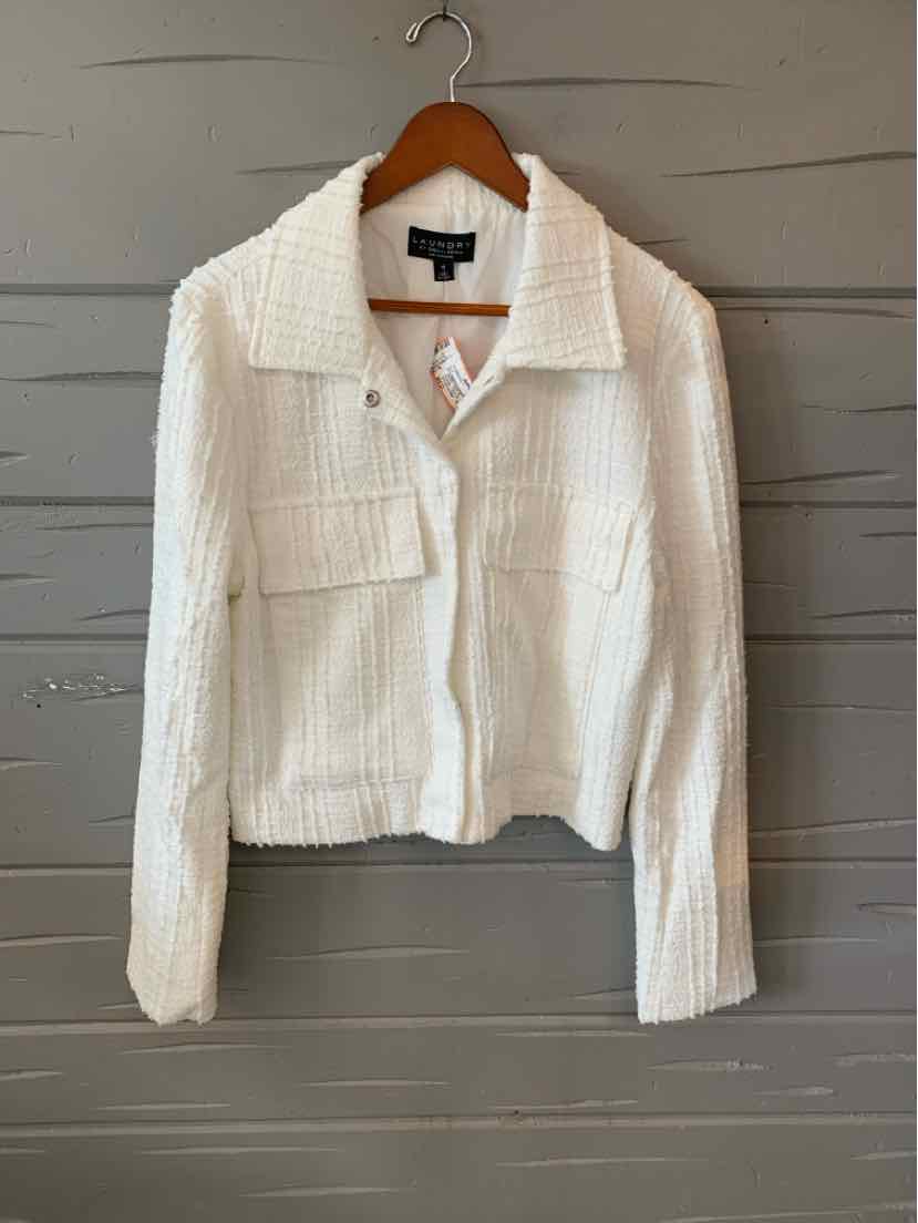 White textured medium-length jacket with collar, front button closure, and two chest pockets hanging on wooden hanger.