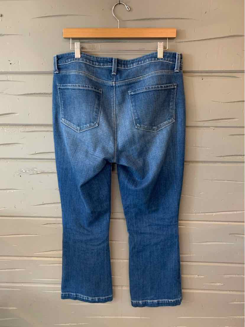 Mid-blue denim jeans with back pockets and visible seam stitching, cropped length, size 10.