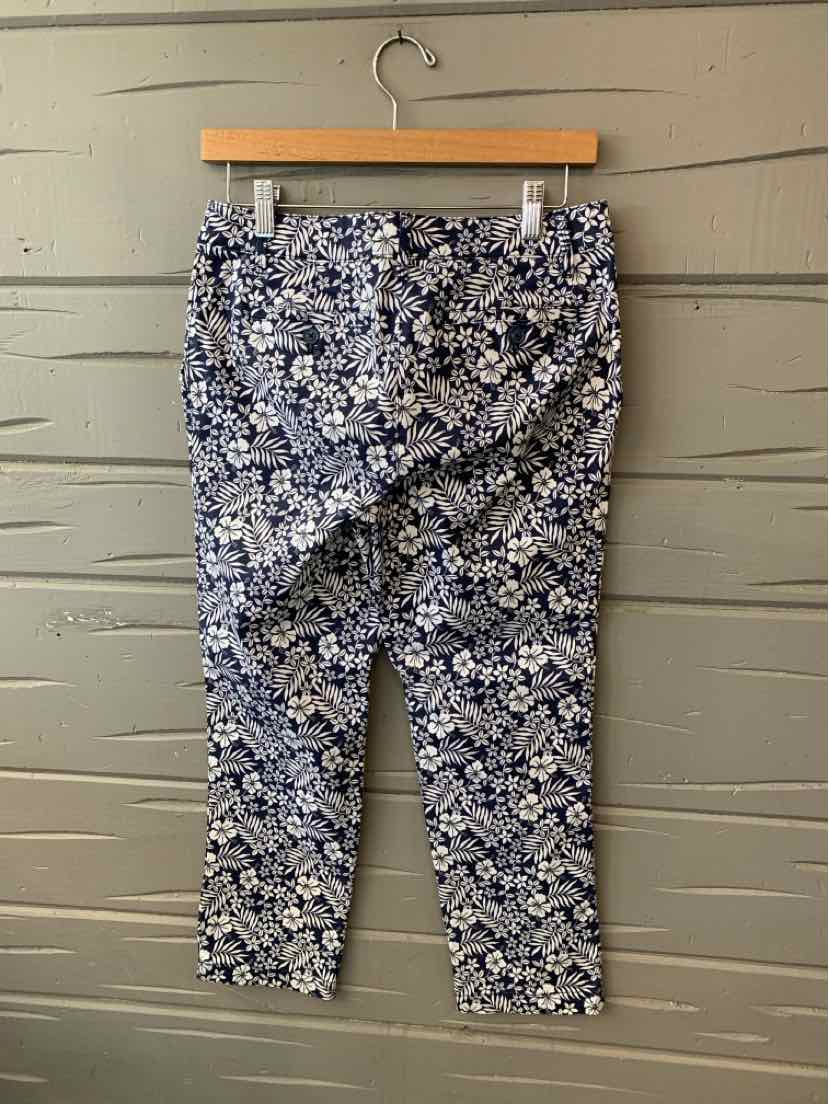 Women's navy blue Tommy Bahama pants with white floral tropical print, size 2.
