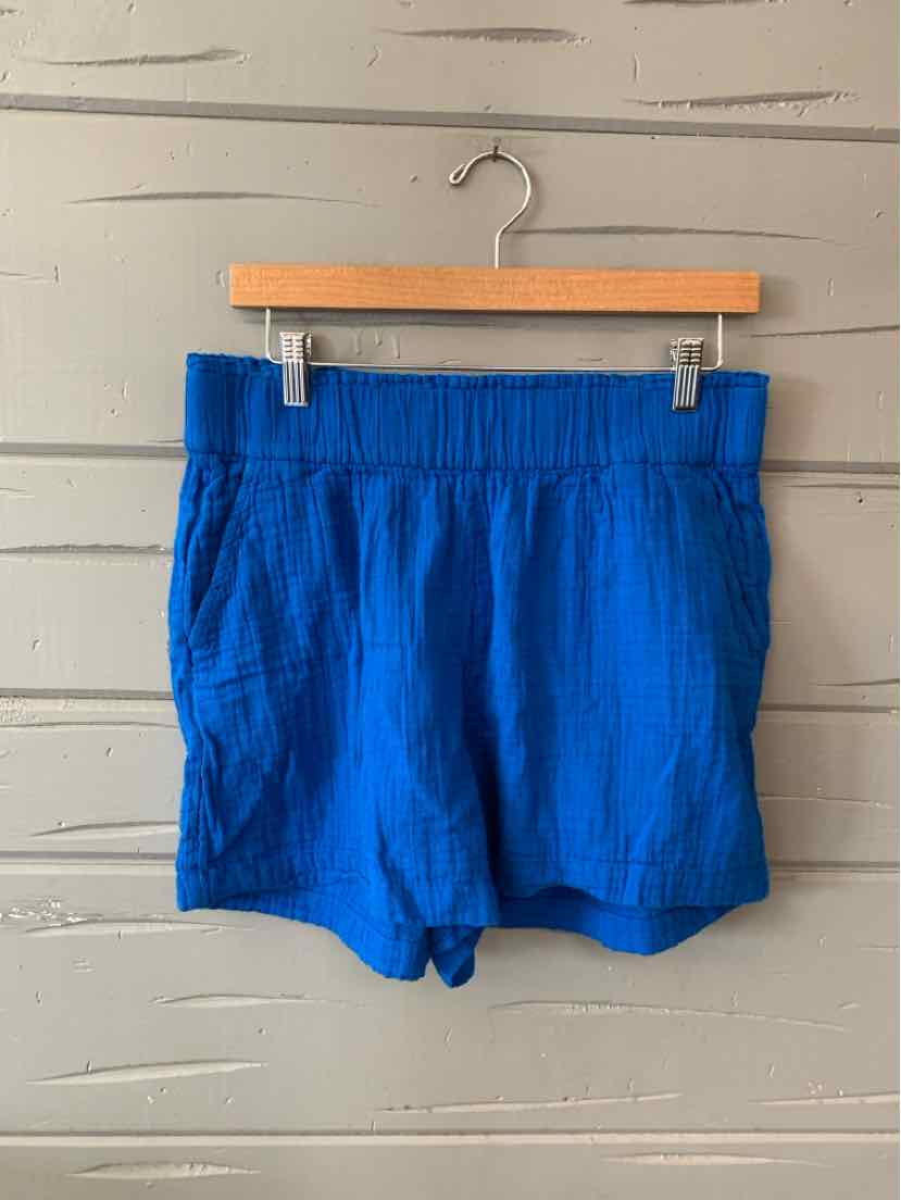 Bright blue casual shorts with elastic waistband and side pockets, lightweight fabric.