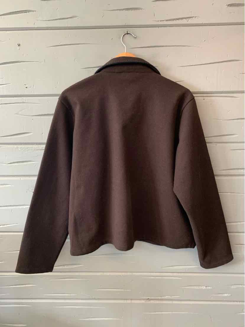 Long-sleeve brown jacket with a loose fit and simple collar hanging on a wooden hanger.