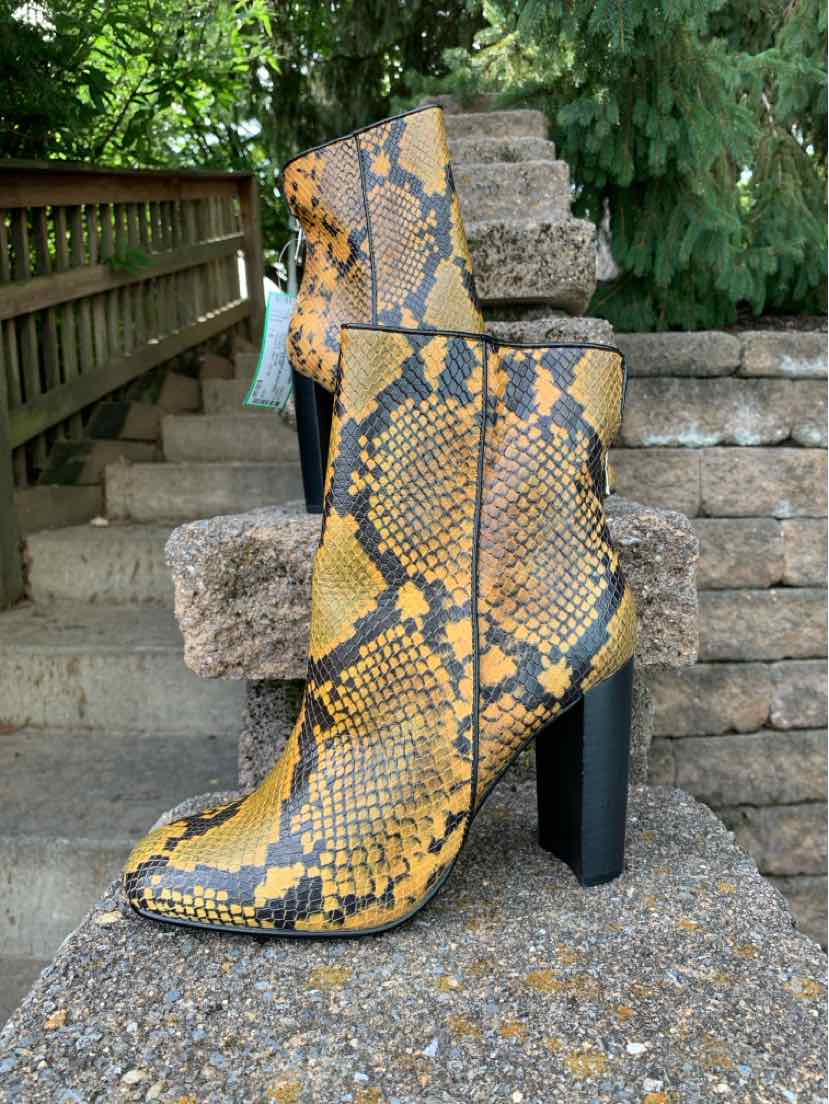 Yellow and black snake print ankle boots with pointed toes and tall block heels, size 7.5.