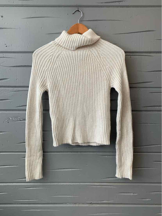 Cream ribbed turtleneck sweater with long sleeves, medium size, slim fit.