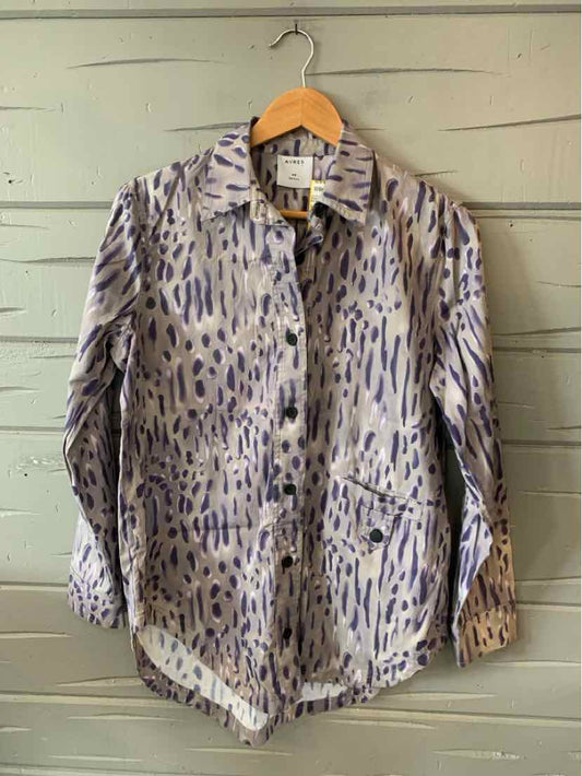 Light beige jacket with blue and gray abstract animal print, front pockets, and a collar.
