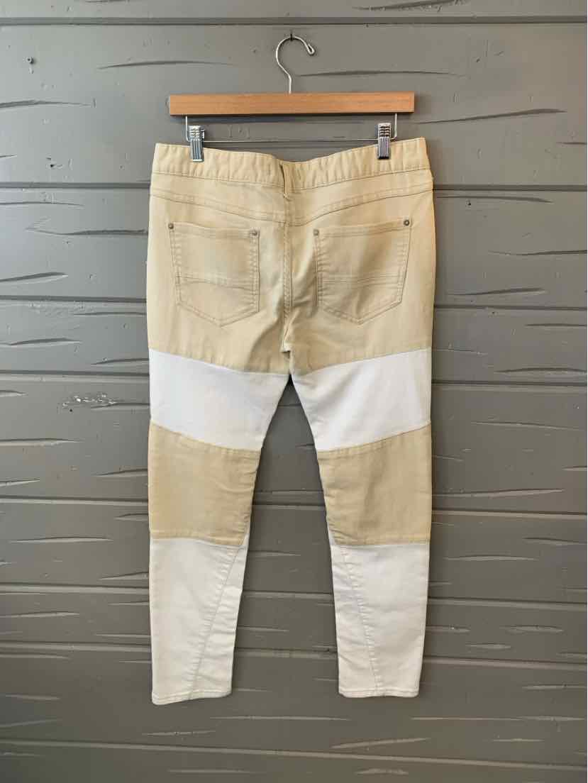 Tan and white color block slim-fit pants with back pockets and belt loops, size 10.