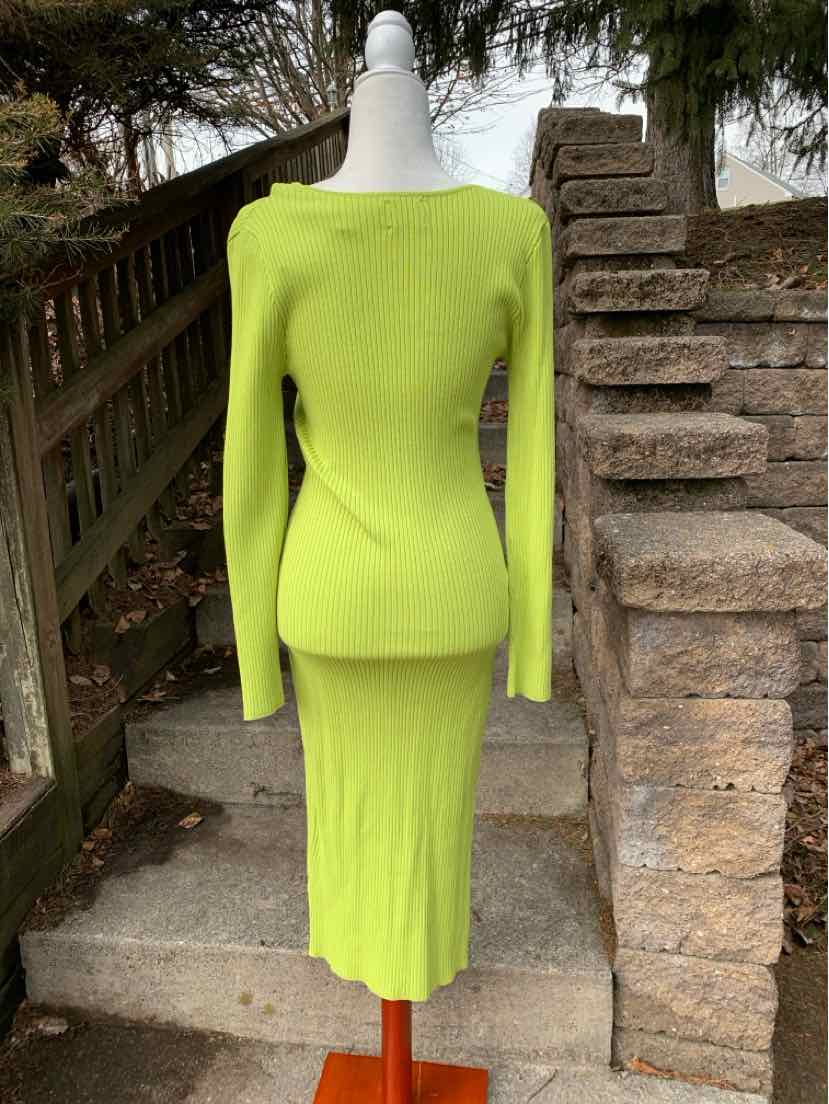 Lime green knit long-sleeve midi dress with fitted waist on mannequin.