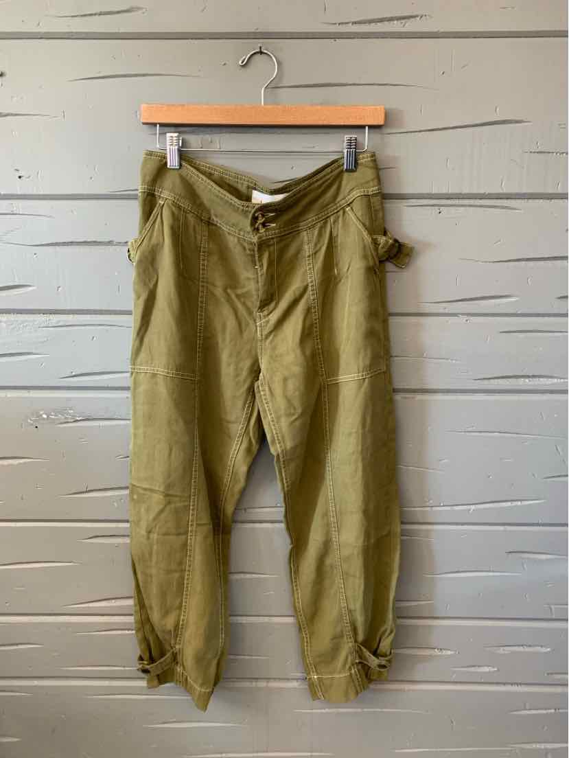 Olive green solid pants with a relaxed fit, tapered legs, and a gathered elastic waistband.