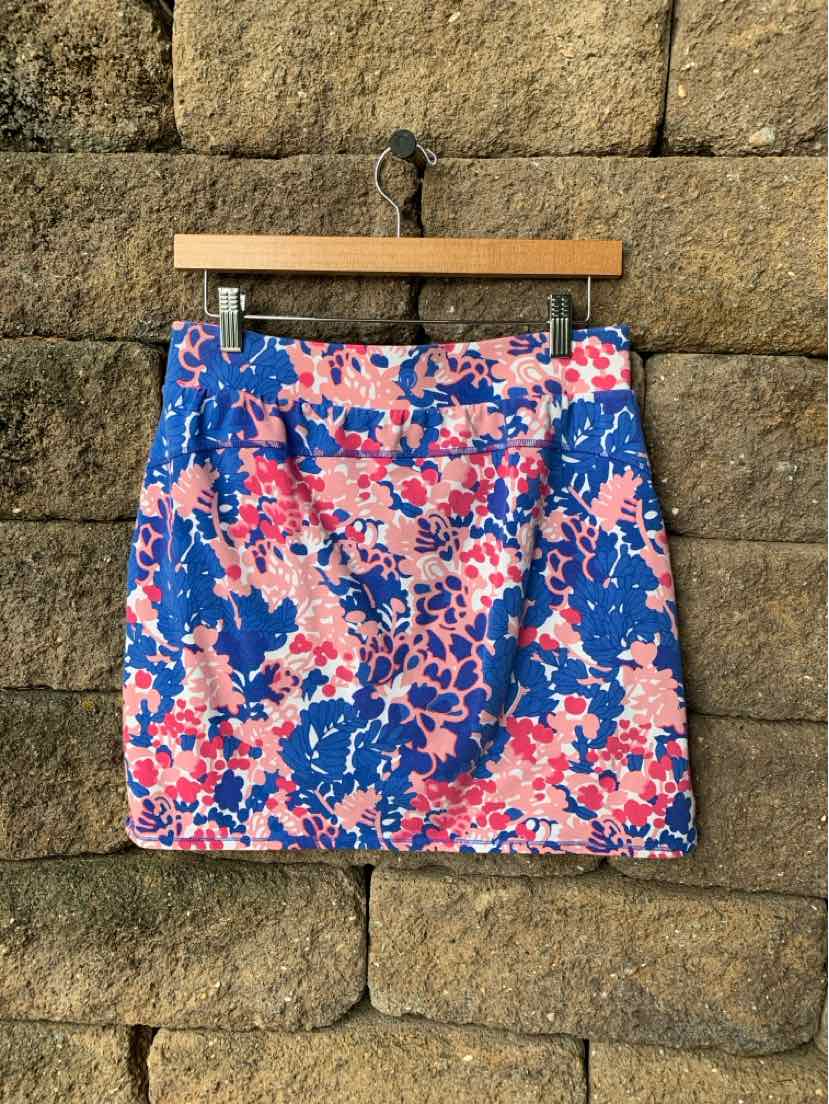 Blue mini skirt with pink and white floral print, straight cut and waistband.
