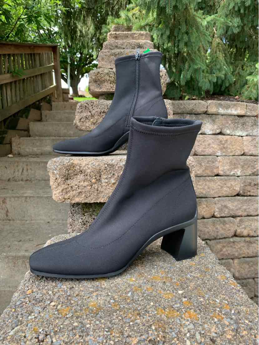 Black mid-calf boots with block heels and side zippers, smooth fabric finish, size 8.5.