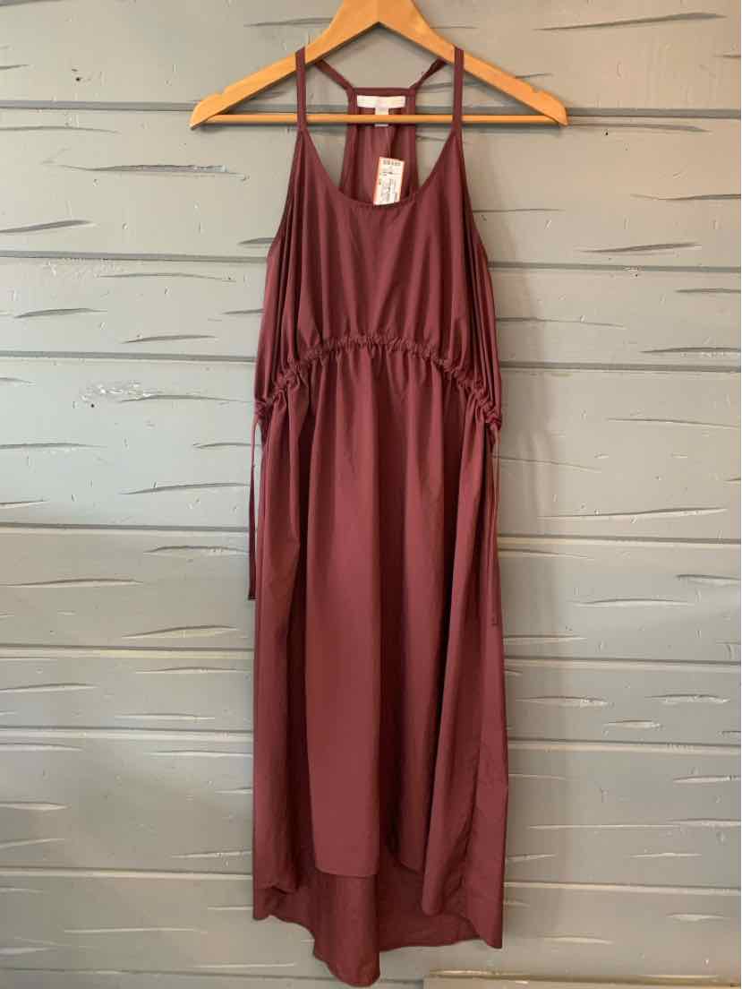 Burgundy sleeveless maxi dress with a gathered waist and thin adjustable straps.