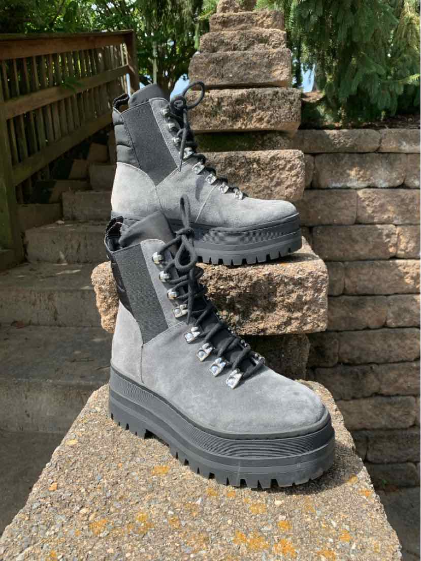 Gray suede lace-up combat boots with thick black platform soles and side elastic panels, size 5.5.