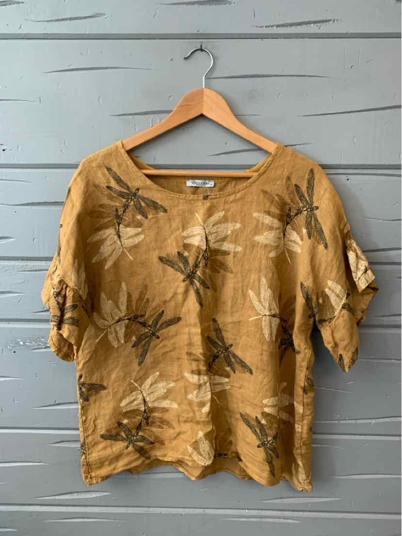 Tan linen blouse with dragonfly print, loose short sleeves, and round neckline.