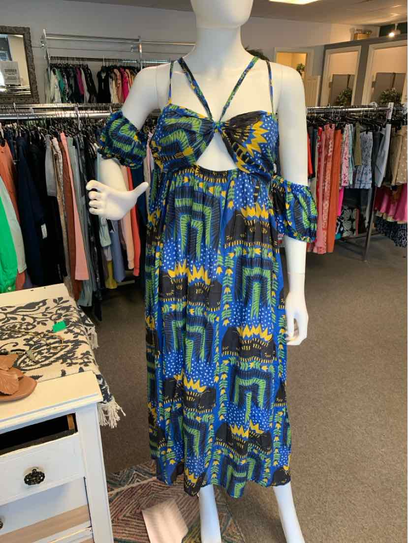 Blue and green geometric-patterned midi dress with cold-shoulder sleeves and crisscross halter neckline.