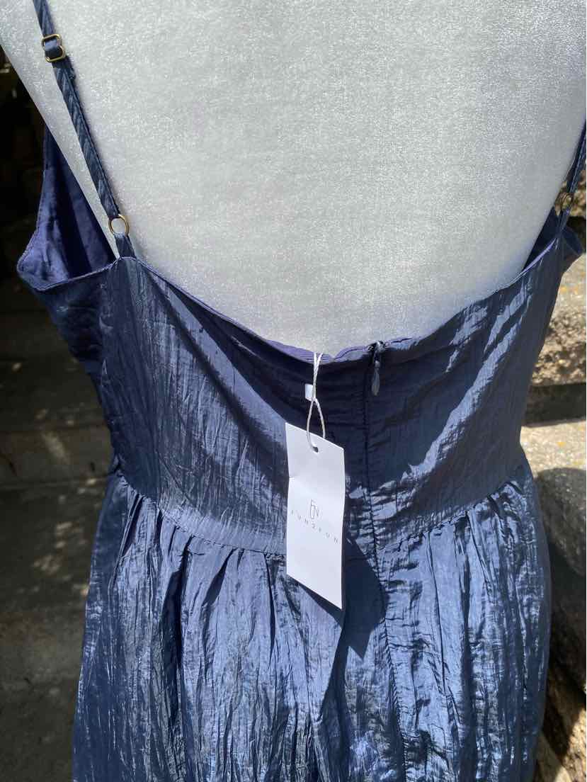 Navy blue satin sleeveless dress with gathered waist and back zipper closure.