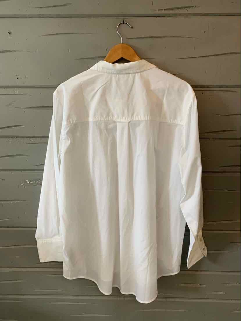 White long-sleeve button-up shirt with classic collar in size XL hanging on wooden hanger.