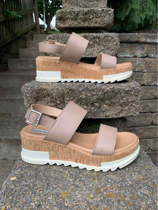 Nude leather sandals with thick white platform sole, two wide straps, and adjustable ankle buckle, size 8.