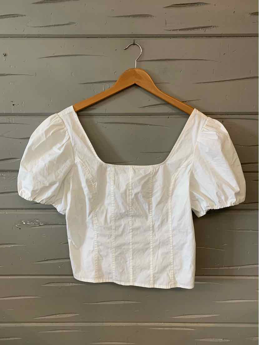 White women's puff sleeve blouse with square neckline, fitted waist, and textured fabric.