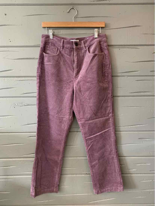 Purple corduroy pants with a high waist, front button and zipper, and straight legs.