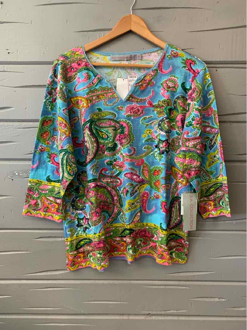 Light blue paisley-print blouse with 3/4 sleeves and yellow, pink, and green accents, size 1X.