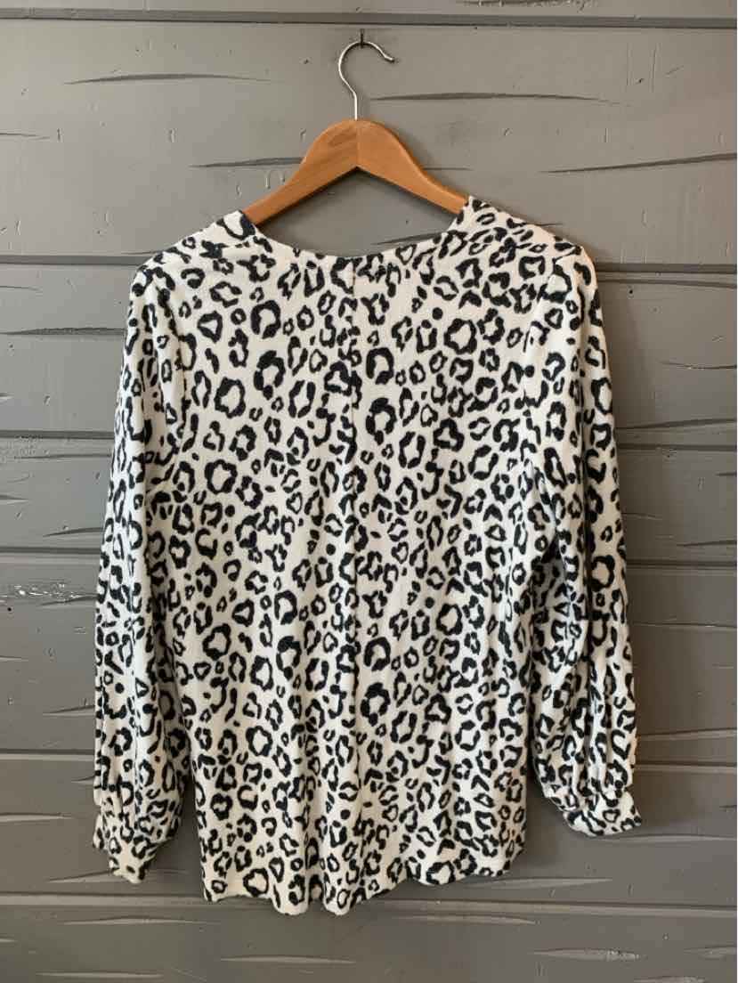 Long-sleeve leopard print blouse in white and black, medium size, lightweight fabric.