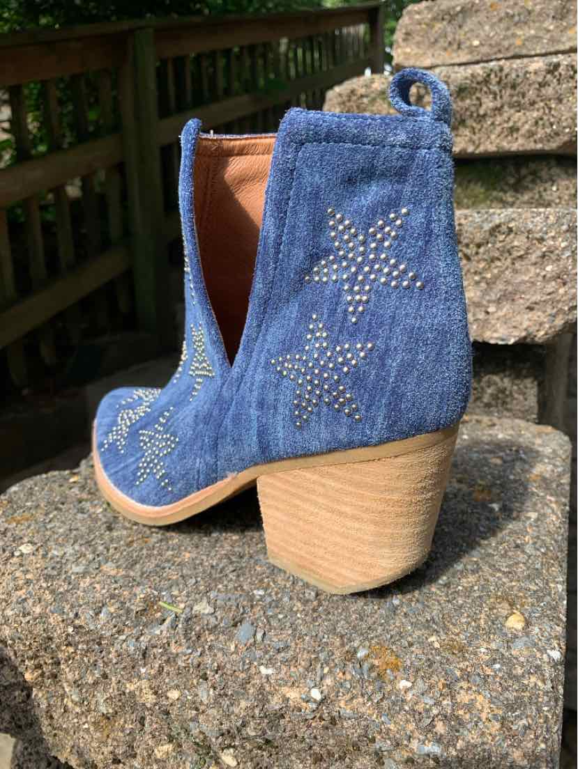 Blue suede ankle boot with stacked wooden heel and star-shaped stud embellishments.