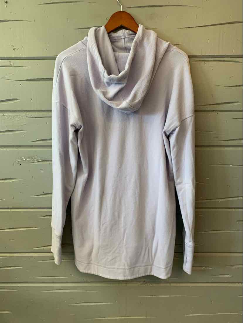 Light lavender long-sleeve hoodie with relaxed fit and kangaroo pocket, hanging on wooden hanger.