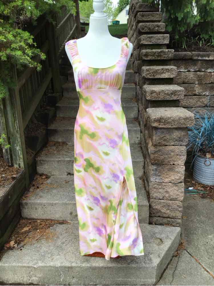 Sleeveless midi dress with pink and green watercolor floral print on white background.