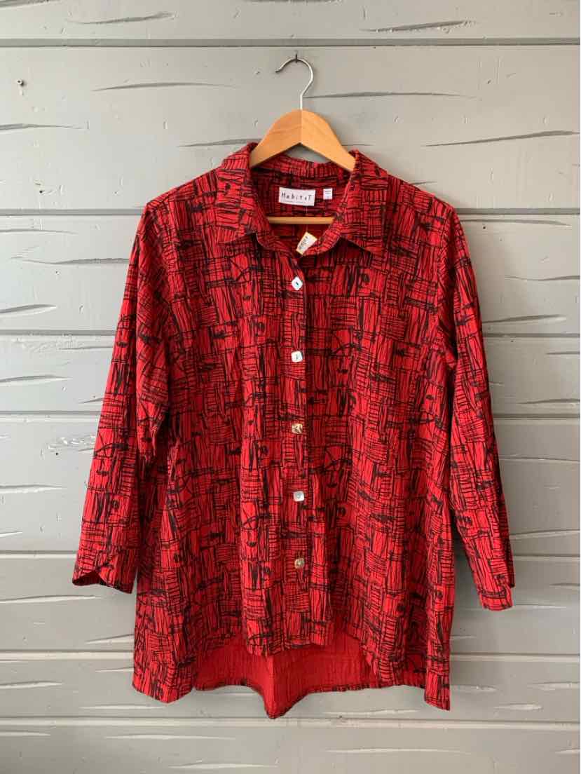 Long-sleeve red patterned button-up shirt with collar and curved hem, size large.